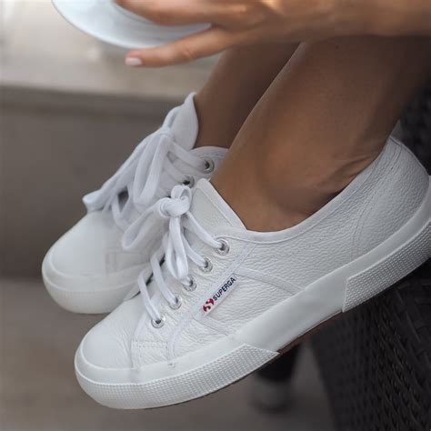 feminine white sneakers.